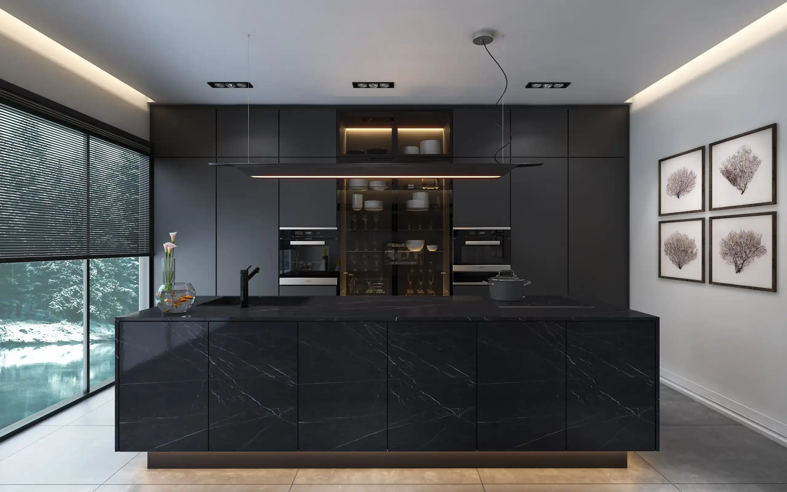 A modern kitchen with black marble counter tops.